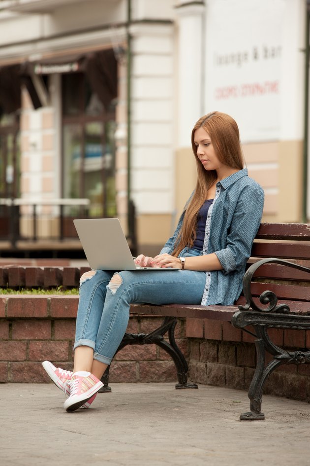 Young stylish woman with a laptop.