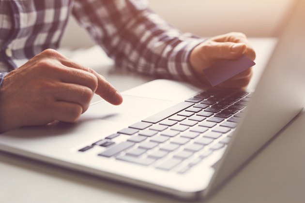 Man using touchpad on notebook