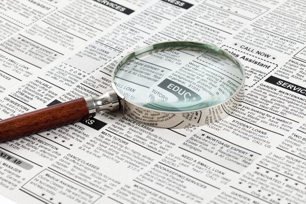 Classified Ad and magnifying glass