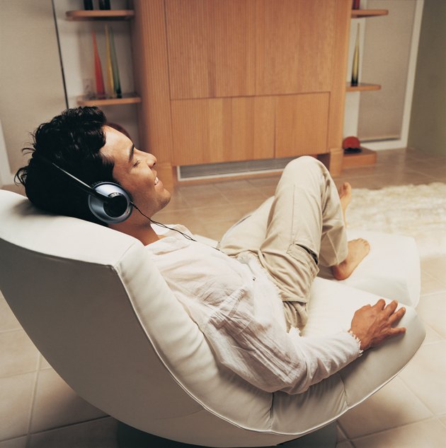 Man Relaxing to Music in His Sitting Room