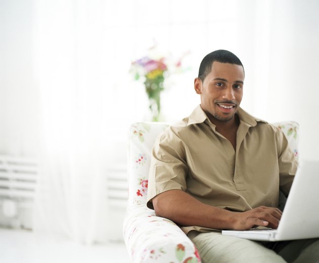 Young man with laptop computer