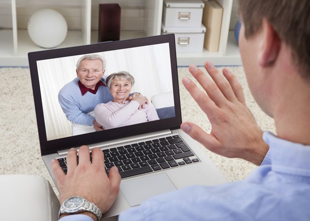 Man Video Conferencing On Laptop