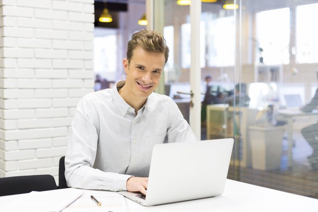 Man working on his laptop at the office in startup