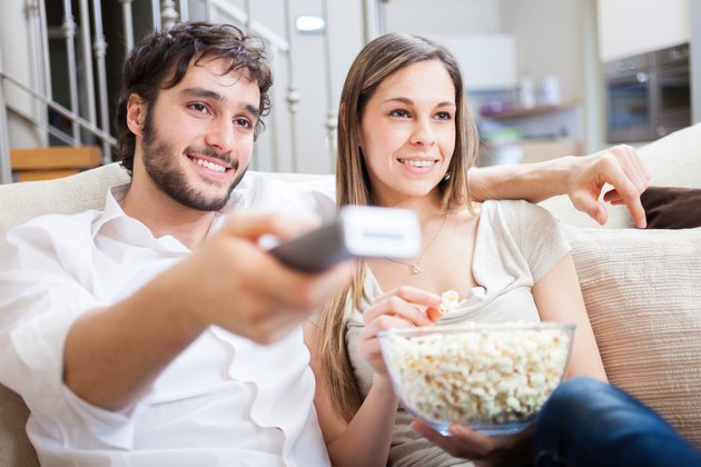 Couple using a remote control