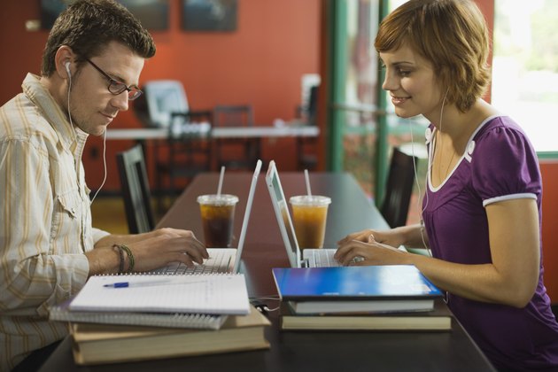 Couple working on laptop computers