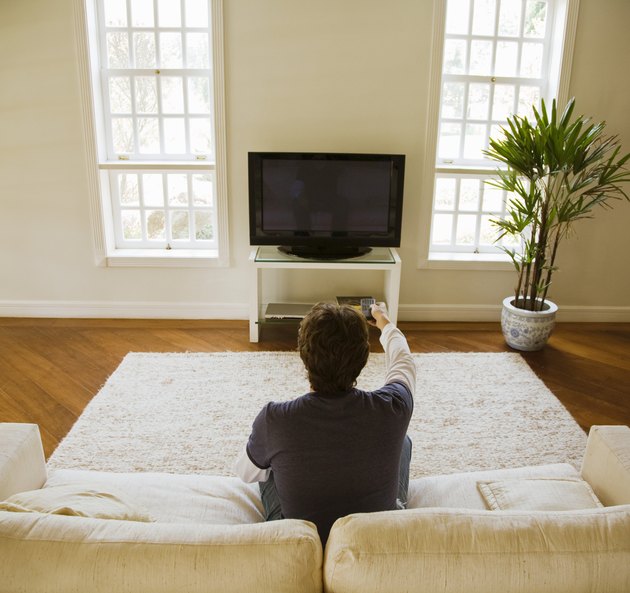 Man watching TV in modern living room