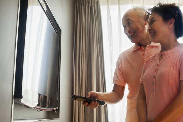 Senior couple watching TV