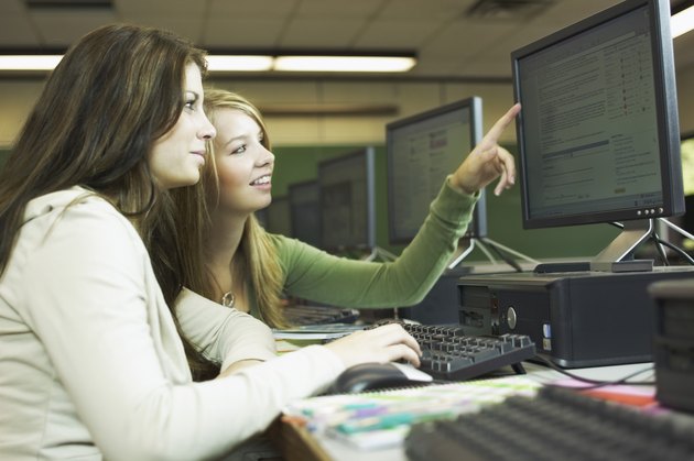 Teenage girls working in computer lab