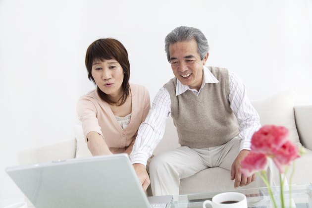 Husband and wife using a laptop