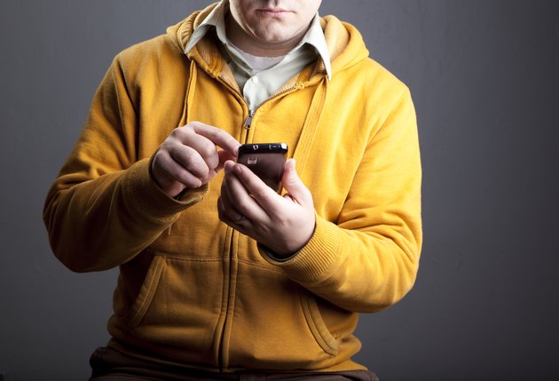 Man using smartphone torso
