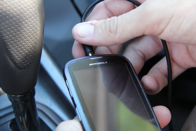 How to Listen to a Cell Phone's Music Player Through a Car Stereo