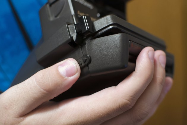 How to Change Batteries on the Polaroid 600 OneStep Express | Techwalla