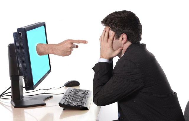 Business man with computer in stress concept