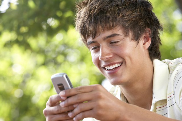 Teenage boy with cellular phone