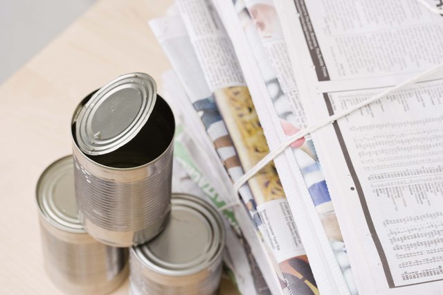 Tin cans with newspapers