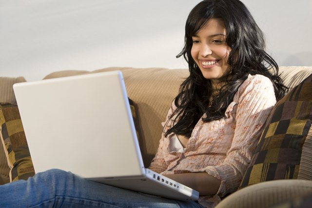 Beautiful Latina Woman Using Laptop At Home