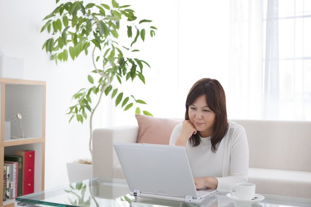 Mature woman using laptop