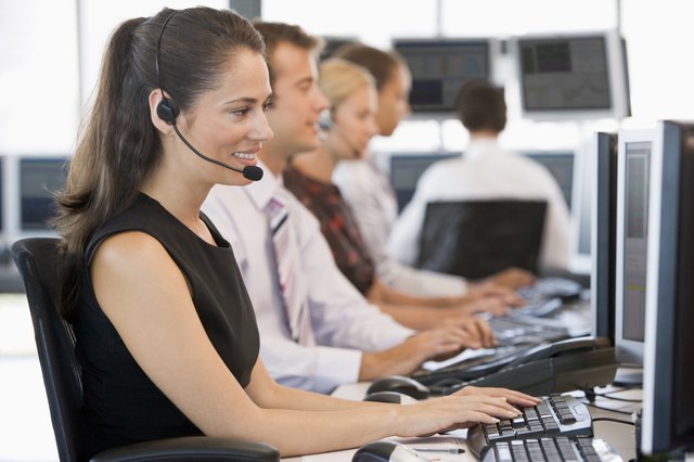 Stock Traders Working At Computers