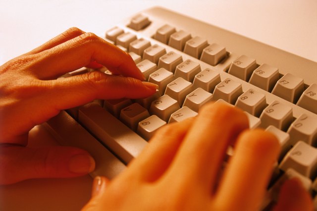 Hands typing on keyboard