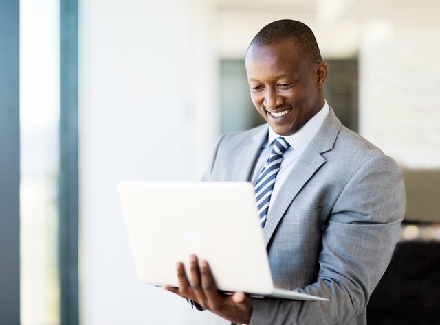 african business man using laptop
