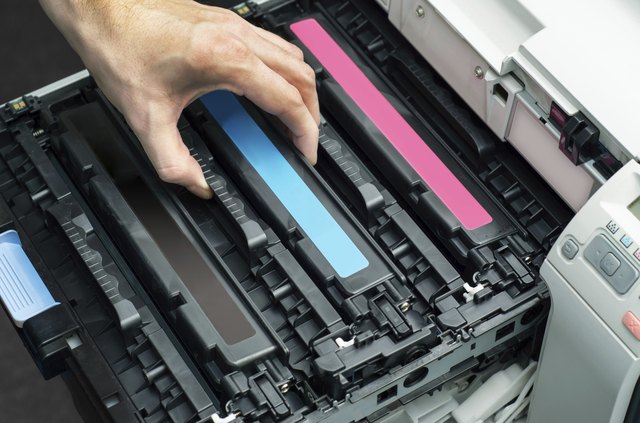 Man puts toner in the printer