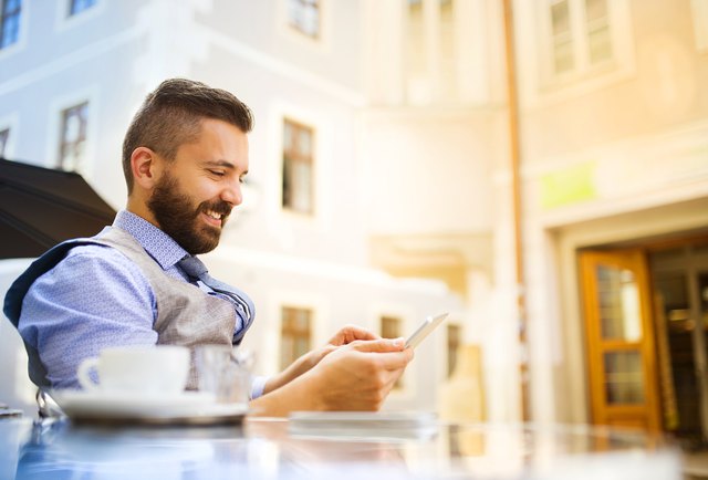 Hipster businessman in cafe