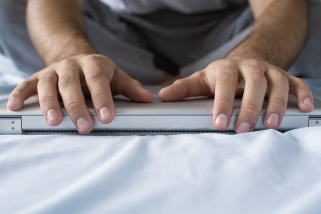 Human hands on a laptop