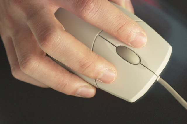 Close-up of hand on computer mouse
