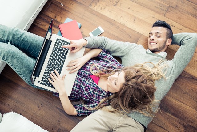 Couple looking at computer laptop
